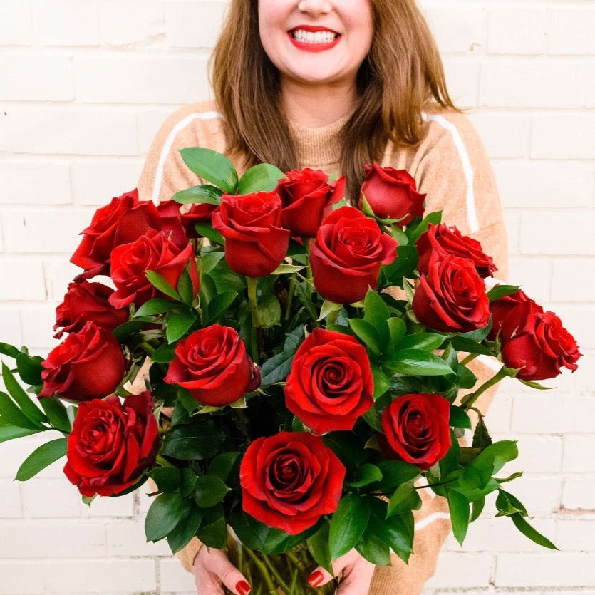2 dozen red roses in a vase