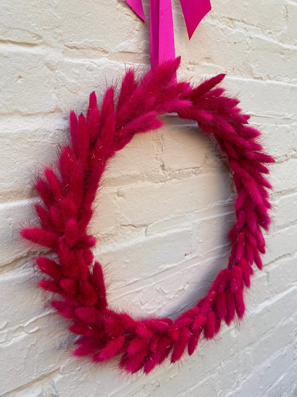 Hot Pink Bunny Tail Wreath, finished with matched satin bow