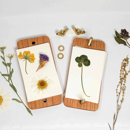 Pressed flowers in mini-wood covered press