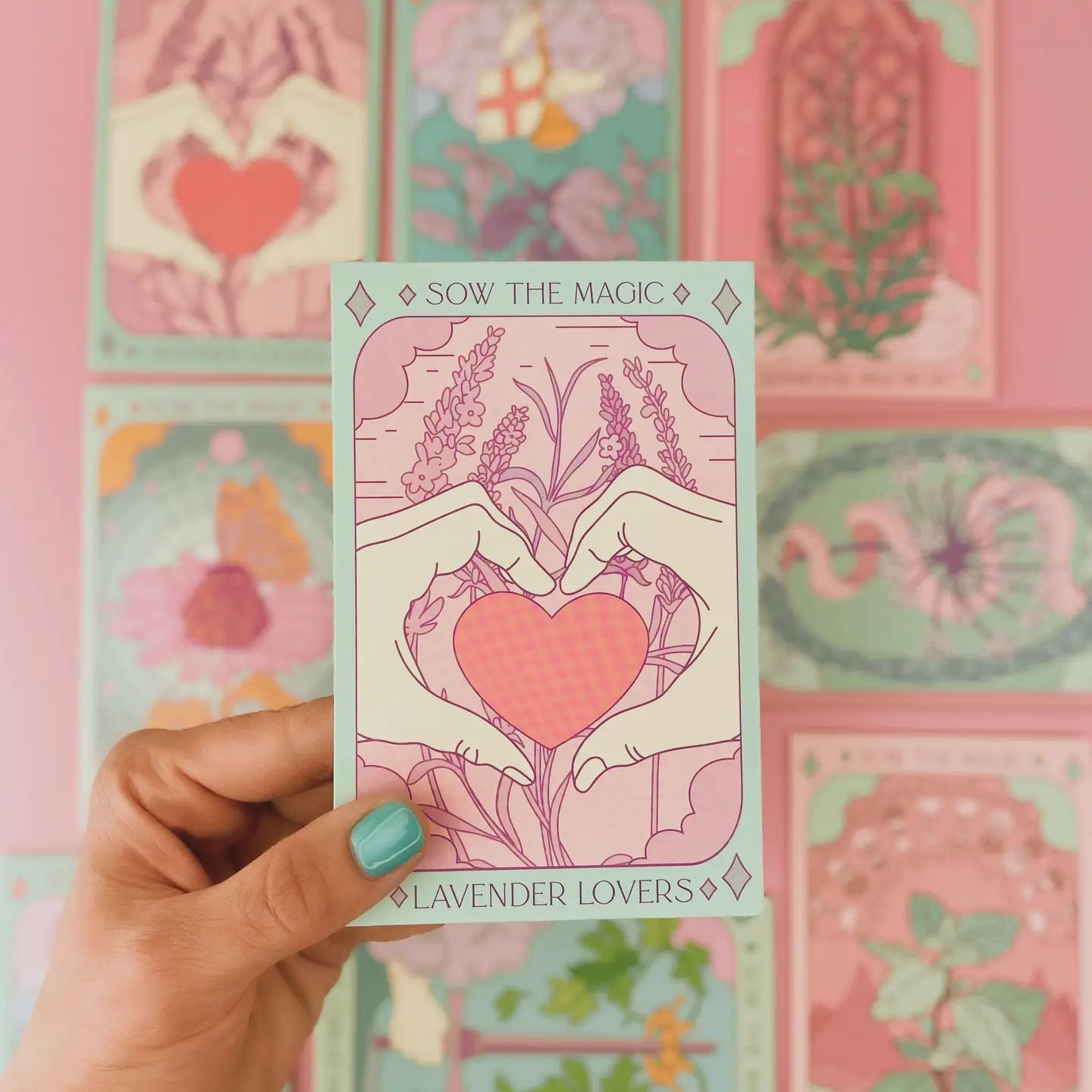 A hand holding a seed packet with a lavender and heart design, labeled 'Lavender Lovers'.