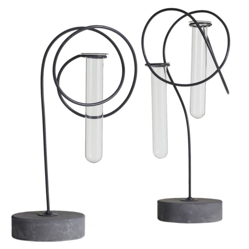 Two modern bud vases with black metal designs and glass elements on a white background.