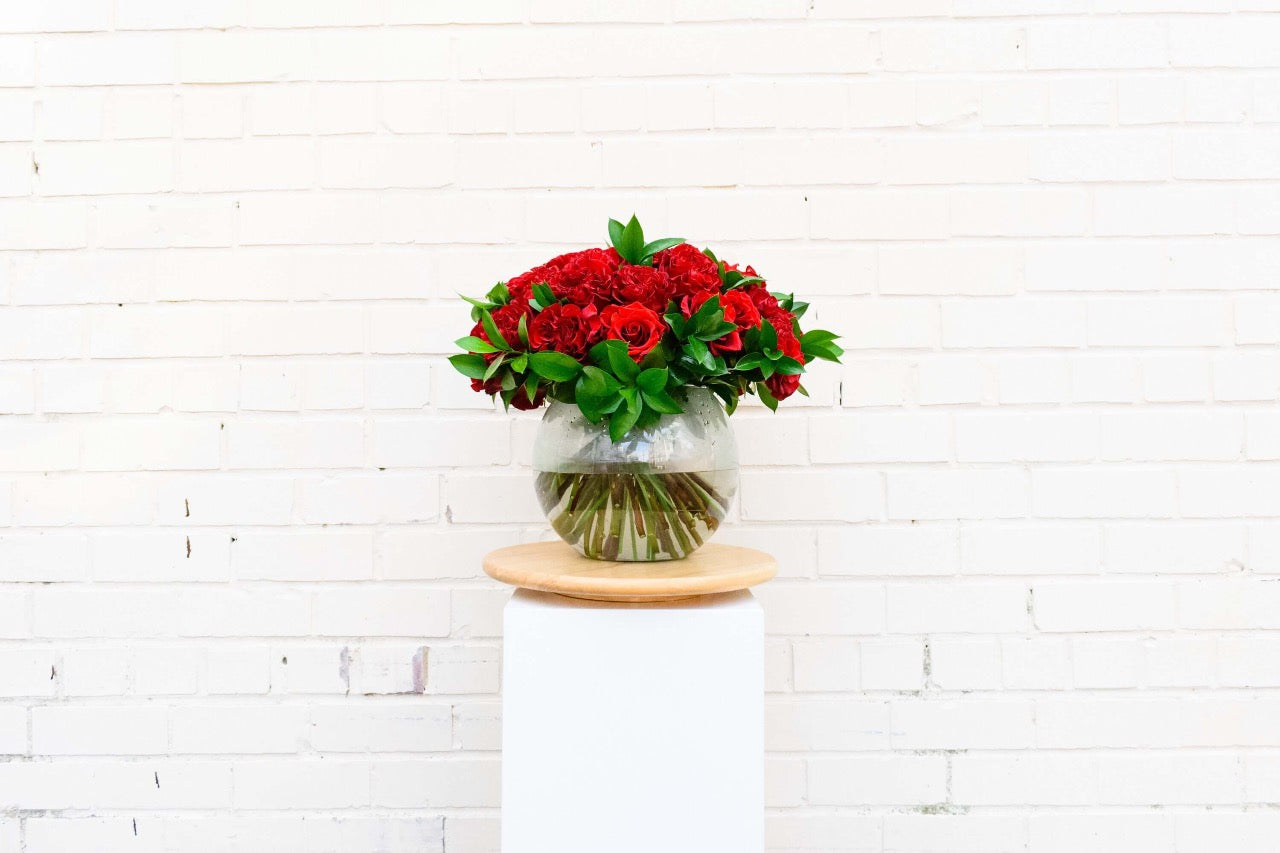 3 dozen red roses in a glass bubble bowl