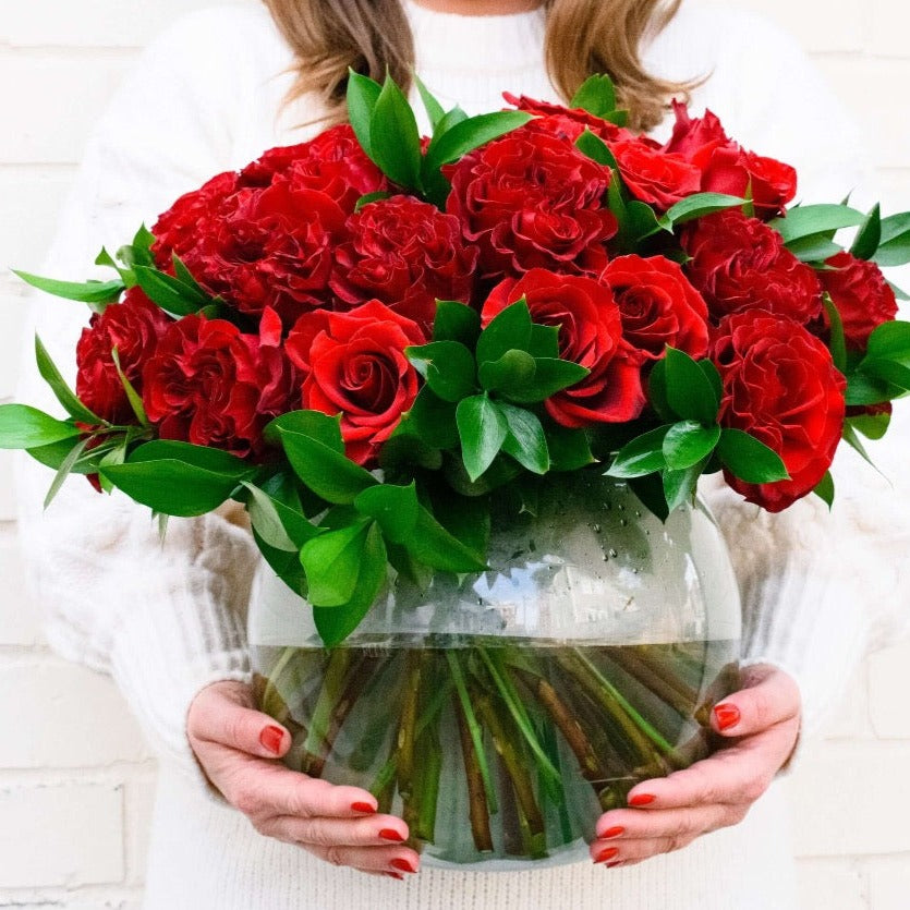 When only the best will do, bewitch the one you love with the most lavish display of deep red roses. 