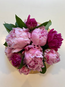 Top view of pink and fuchsia peonies