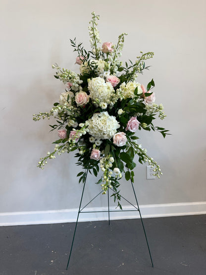 Funeral spray on easel