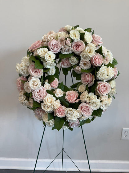 Floral sympathy wreath on easel