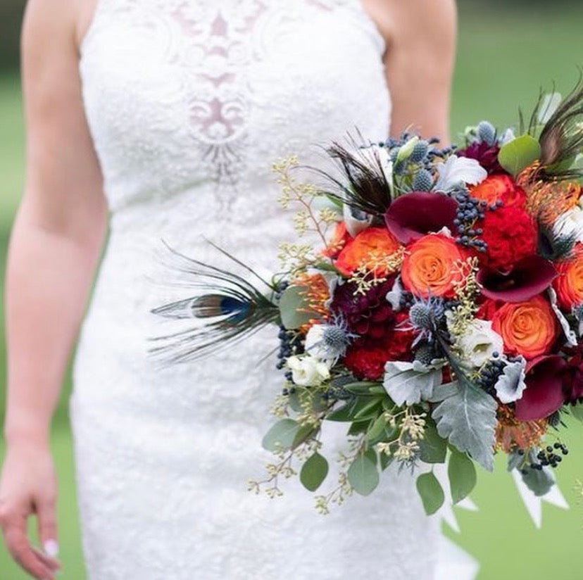 Rustic wedding bouqiet with feathers